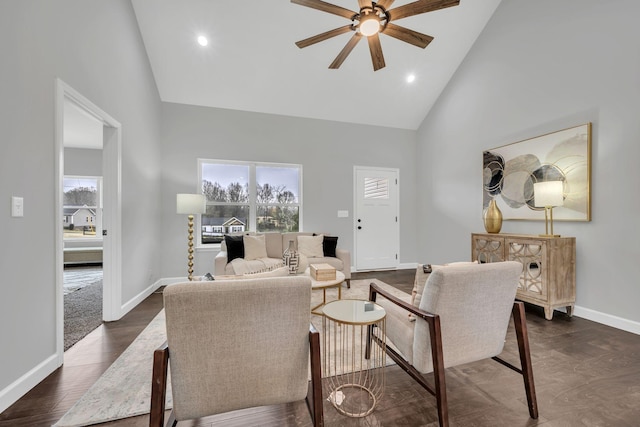 living room featuring dark wood-style flooring, recessed lighting, ceiling fan, high vaulted ceiling, and baseboards