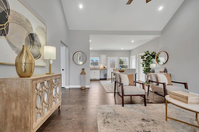 living area featuring ceiling fan, baseboards, dark wood-style flooring, and recessed lighting