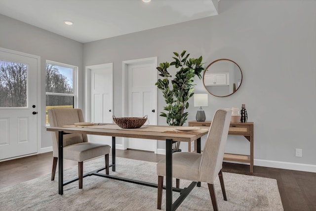 dining space featuring recessed lighting, wood finished floors, and baseboards