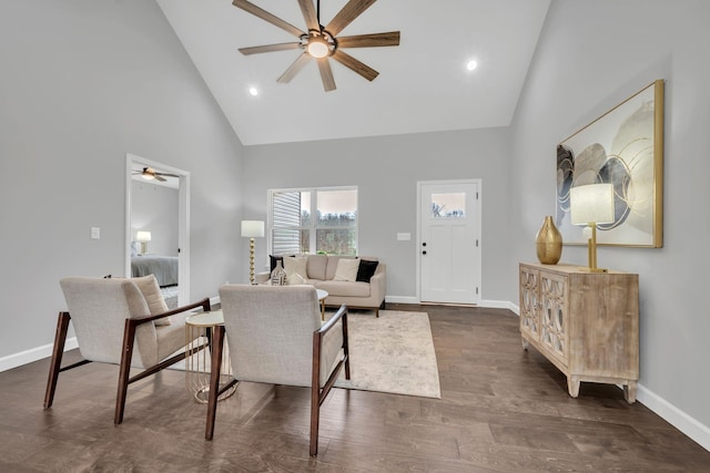 living room with high vaulted ceiling, dark wood-style floors, baseboards, and a ceiling fan