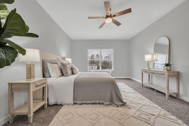 bedroom featuring a ceiling fan, carpet flooring, and baseboards