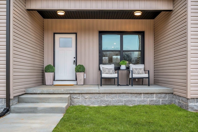 view of exterior entry featuring a porch