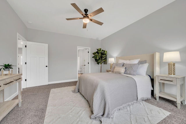 bedroom featuring ensuite bathroom, ceiling fan, carpet flooring, and baseboards