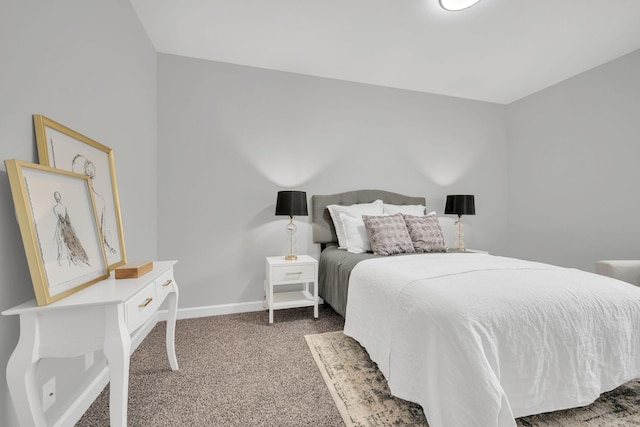 bedroom with carpet and baseboards