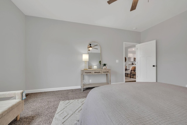 carpeted bedroom featuring ceiling fan and baseboards