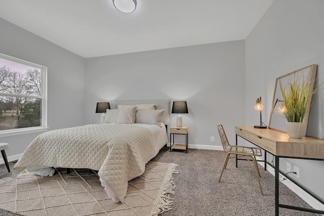 bedroom featuring carpet flooring and baseboards