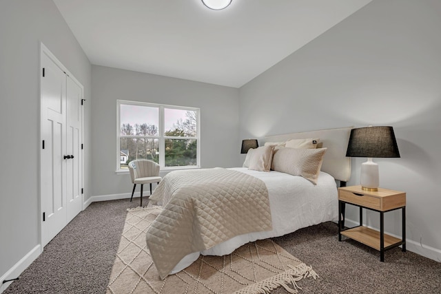 carpeted bedroom featuring baseboards