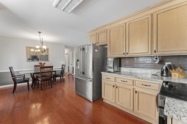 kitchen featuring tasteful backsplash, stainless steel appliances, dark wood-style flooring, and light brown cabinetry