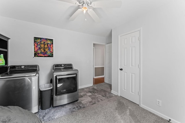 laundry room featuring laundry area, carpet floors, a ceiling fan, baseboards, and washing machine and clothes dryer