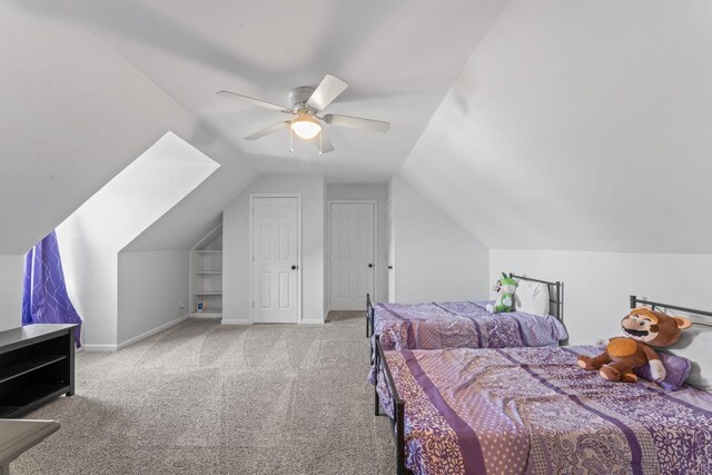 bedroom featuring vaulted ceiling, carpet flooring, a ceiling fan, and baseboards