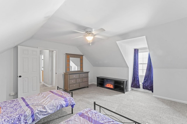 bedroom featuring carpet floors, baseboards, and lofted ceiling