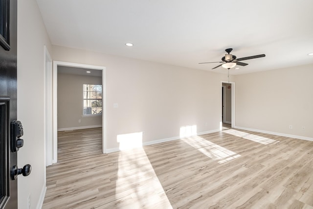 unfurnished room featuring light wood finished floors, baseboards, a ceiling fan, and recessed lighting