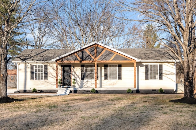 ranch-style house featuring crawl space, a shingled roof, and a front yard