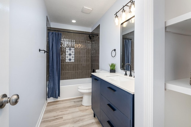 full bath with shower / tub combo with curtain, toilet, vanity, wood finished floors, and baseboards