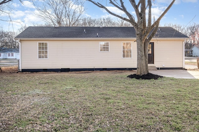 back of house featuring crawl space, fence, a lawn, and a patio