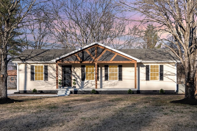 ranch-style house with crawl space, a shingled roof, and a front yard