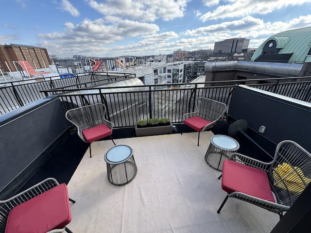 balcony featuring a view of city