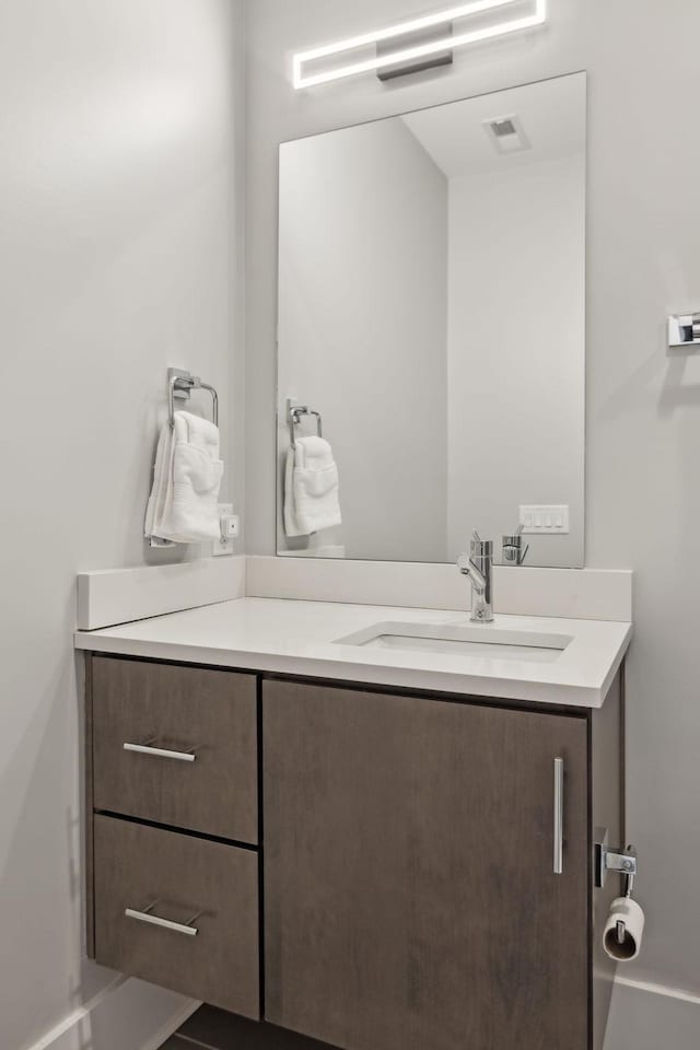 bathroom featuring visible vents and vanity