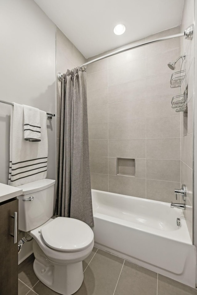 full bath featuring shower / bath combination with curtain, vanity, toilet, and tile patterned floors