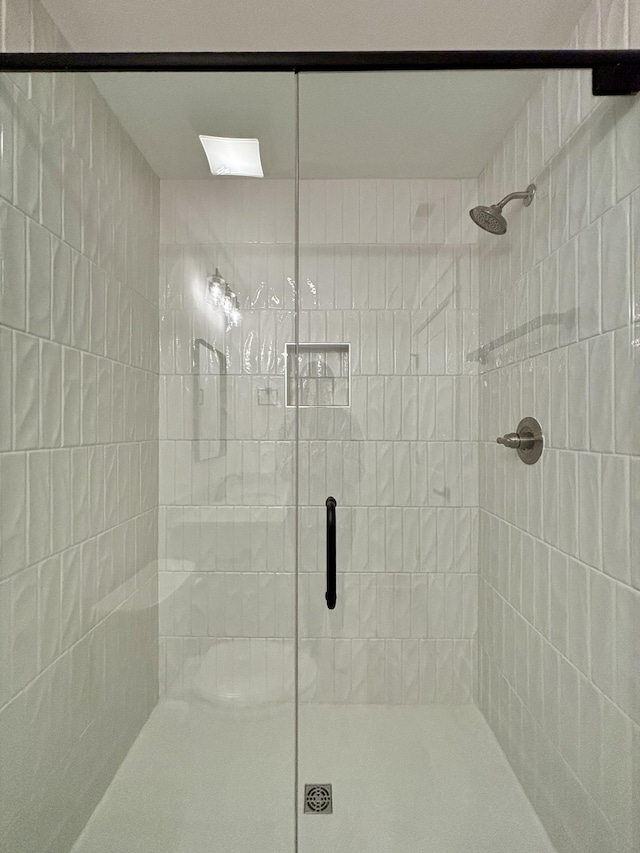 bathroom featuring a shower stall