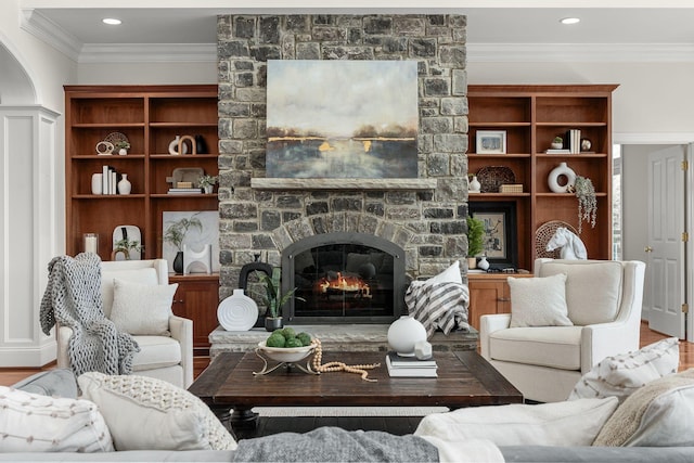 living area with crown molding, a fireplace, wood finished floors, and recessed lighting