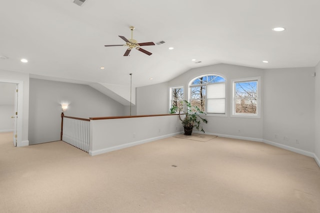 spare room featuring carpet floors, recessed lighting, vaulted ceiling, ceiling fan, and baseboards