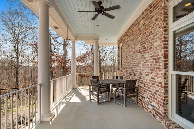 balcony with a ceiling fan and outdoor dining area