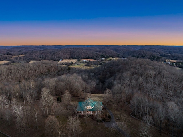 aerial view featuring a view of trees