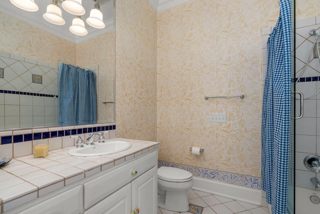 bathroom featuring wallpapered walls, baseboards, toilet, tile patterned floors, and crown molding