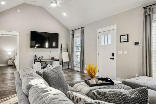 living area with lofted ceiling, baseboards, a ceiling fan, and wood finished floors