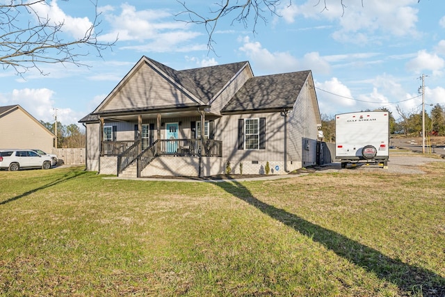 view of front of home featuring crawl space, covered porch, a shingled roof, and a front lawn