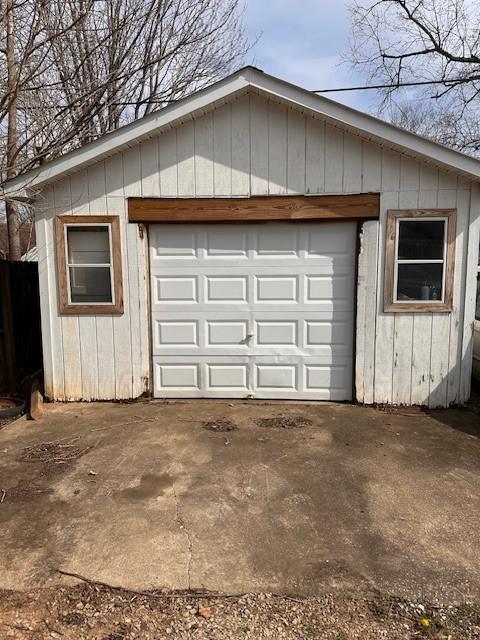 detached garage featuring driveway