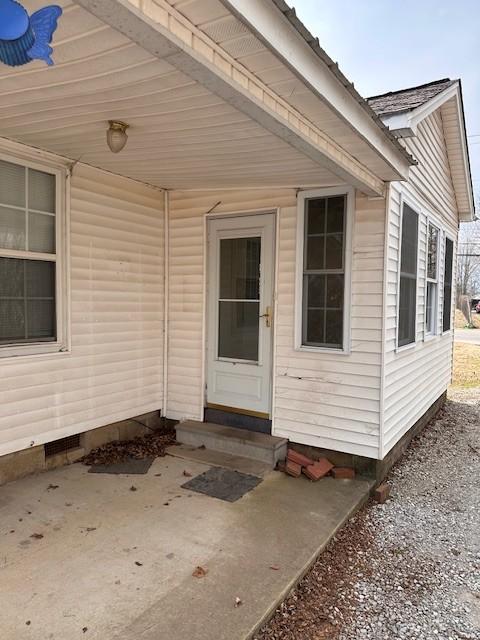 doorway to property featuring crawl space