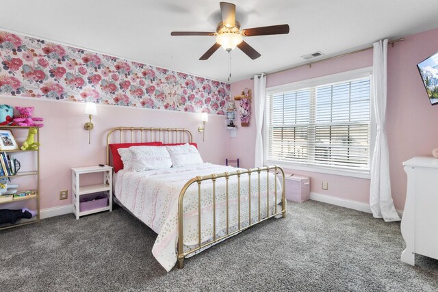 bedroom with wallpapered walls, baseboards, visible vents, ceiling fan, and carpet floors