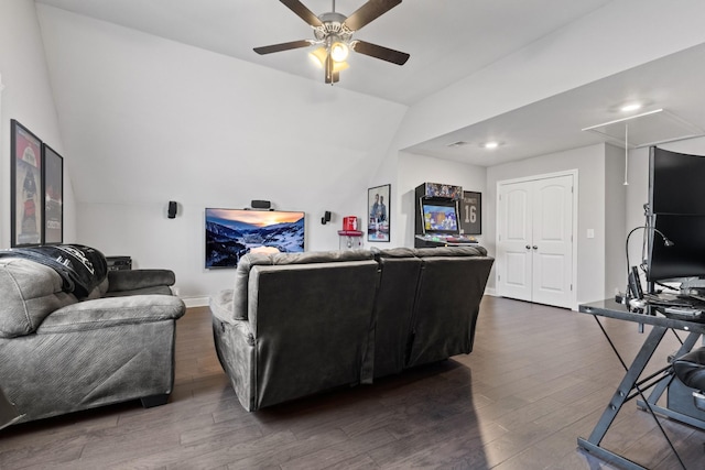 living room with ceiling fan, baseboards, vaulted ceiling, dark wood finished floors, and attic access