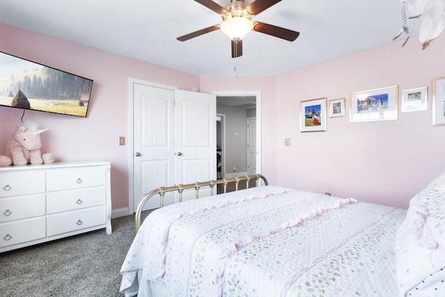 bedroom featuring dark carpet, a ceiling fan, and baseboards