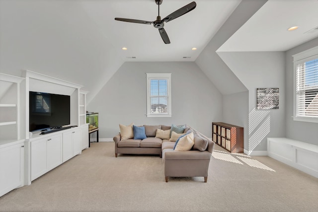 living room with light carpet, baseboards, visible vents, and lofted ceiling