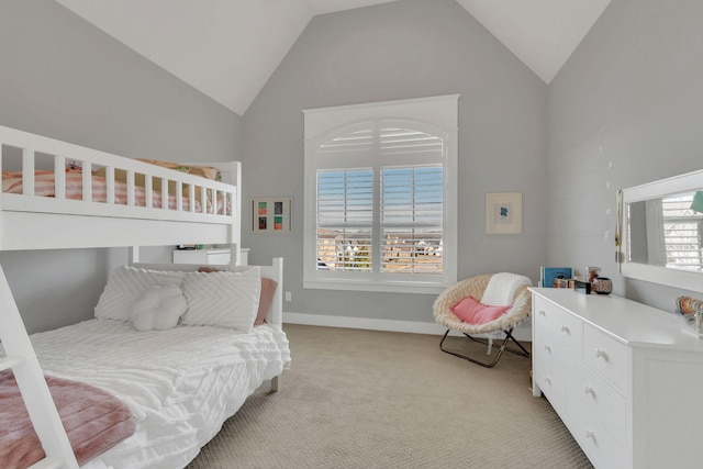 bedroom featuring light carpet, high vaulted ceiling, and baseboards