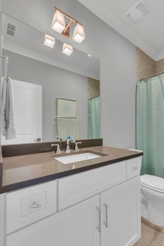 full bathroom with toilet, visible vents, and vanity