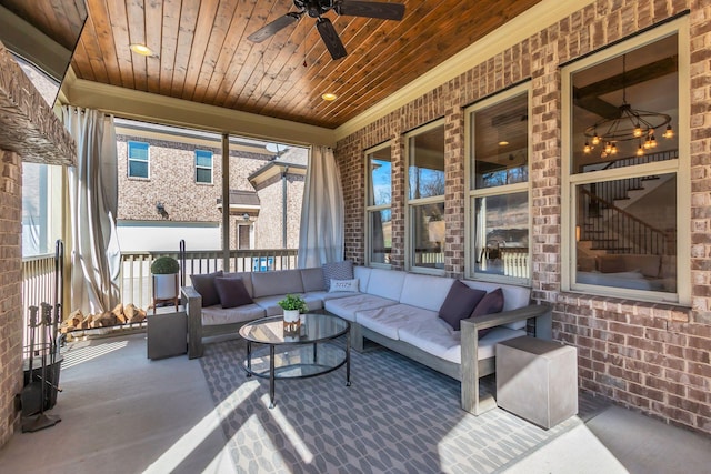 view of patio / terrace with ceiling fan and an outdoor living space