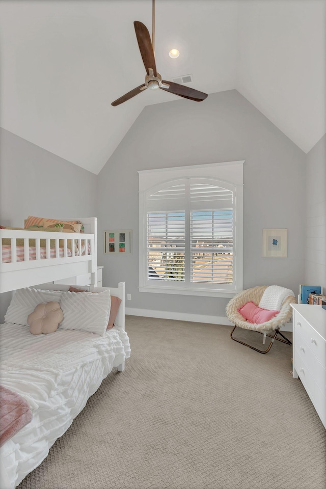 carpeted bedroom with visible vents, vaulted ceiling, baseboards, and ceiling fan