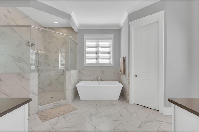 full bathroom with marble finish floor, ornamental molding, a freestanding bath, and vanity