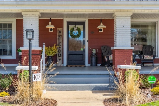 property entrance with covered porch