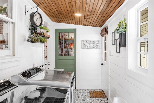 interior space featuring independent washer and dryer and wooden ceiling