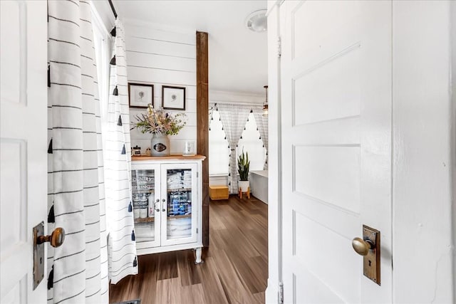 hallway with wood finished floors and french doors