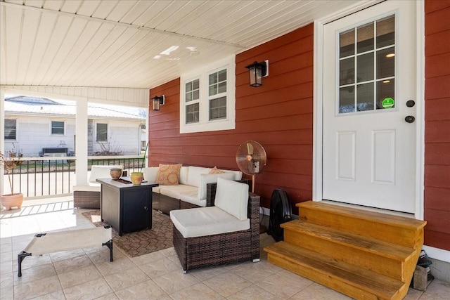 view of patio / terrace featuring a porch, entry steps, and outdoor lounge area