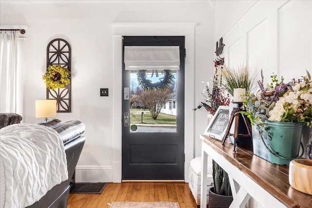 doorway with wood finished floors