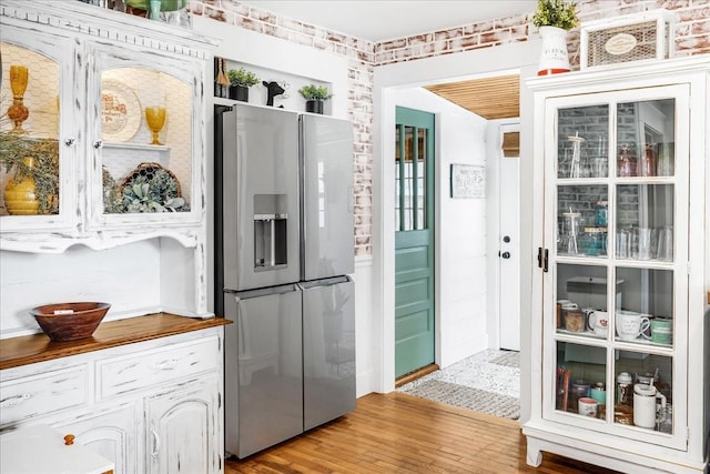 kitchen featuring light wood-style floors and stainless steel fridge with ice dispenser