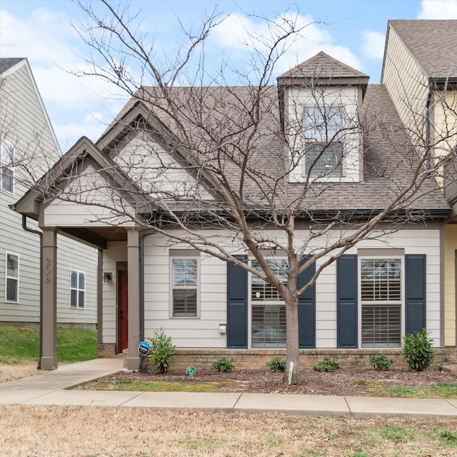 view of front of property with a shingled roof