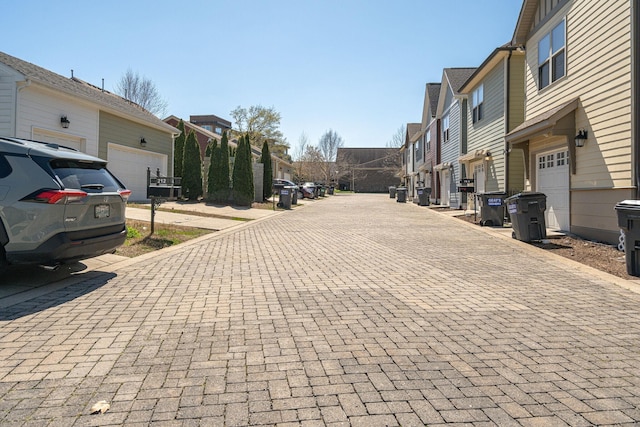 view of decorative road with a residential view